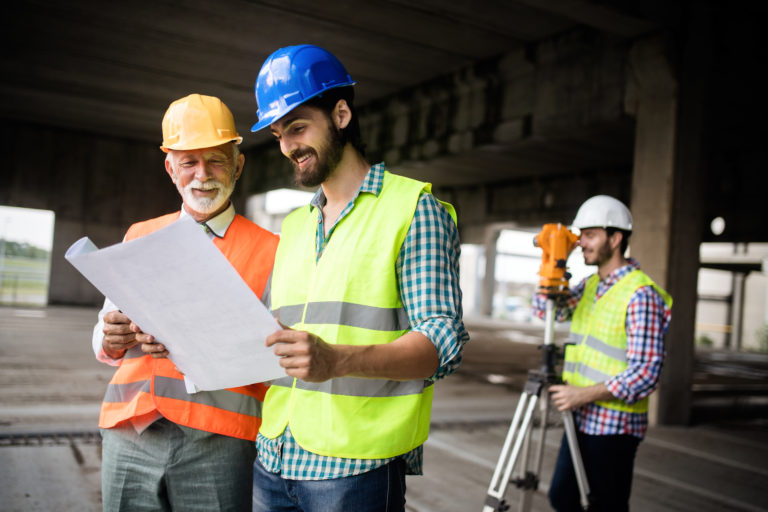 group of construction engineers working on a jobsite