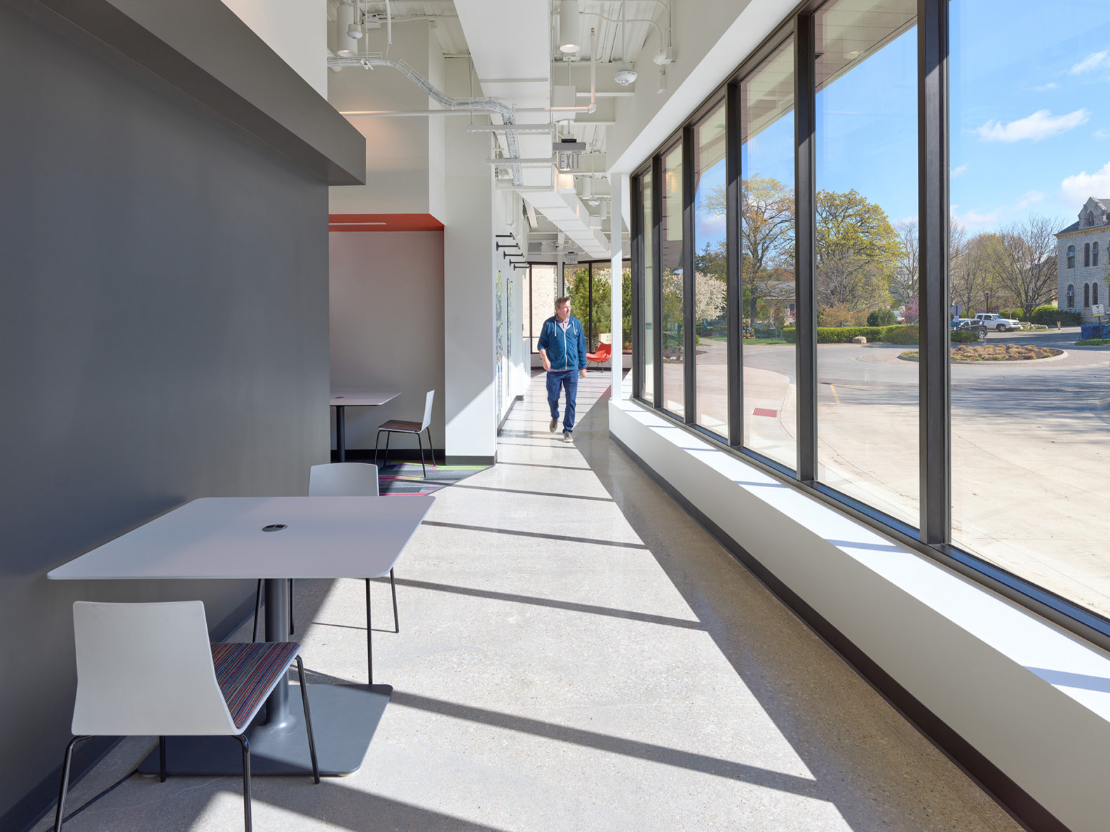 A long hallway with windows in the KSU Morris Family Multicultural Student Center