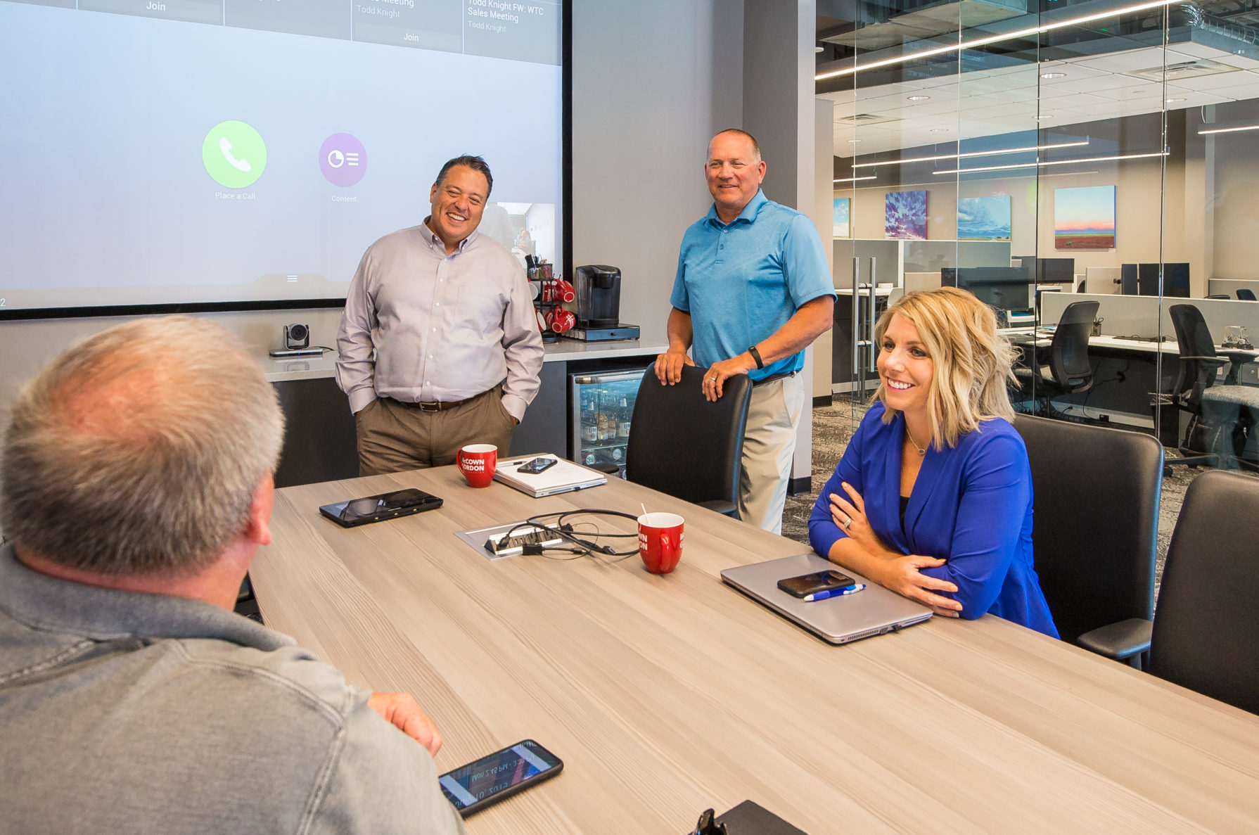 McCownGordon Construction associates laughing and collaborating in the office