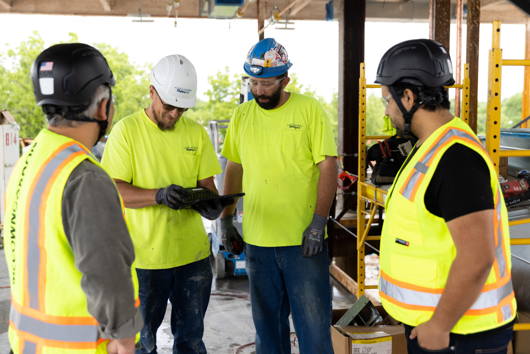 McCownGordon associates talking to trade partners on a construction site