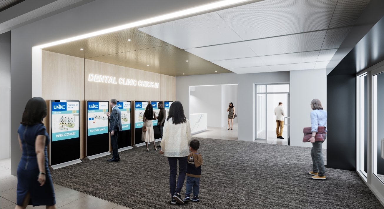 Patients checking in on screens in the North clinic lobby of UMKC Healthcare Delivery and Innovation Building