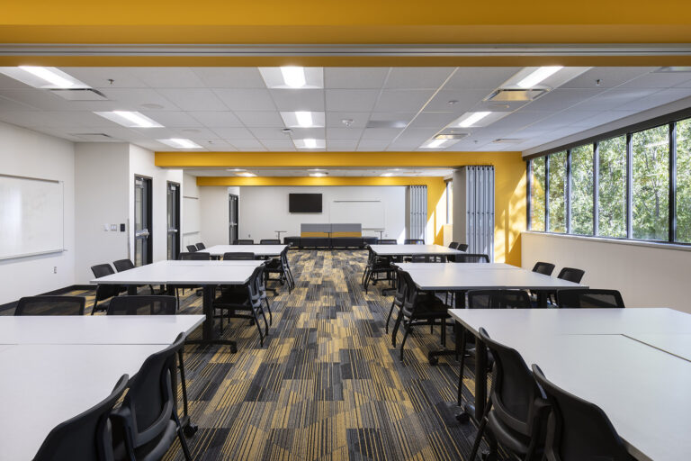 Empty tables used for collaboration space at the Hickman Mills Real World Learning Center.
