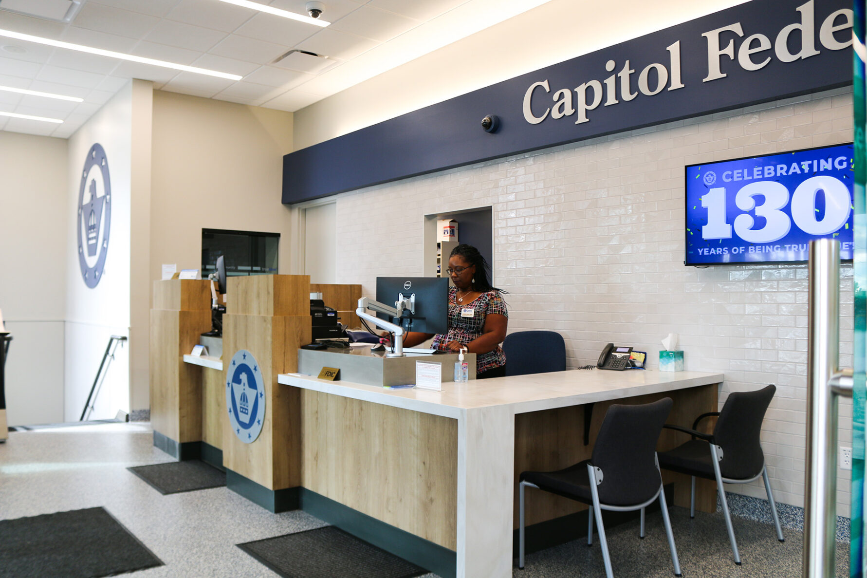 Women working at a desk at a Capitol Federal bank