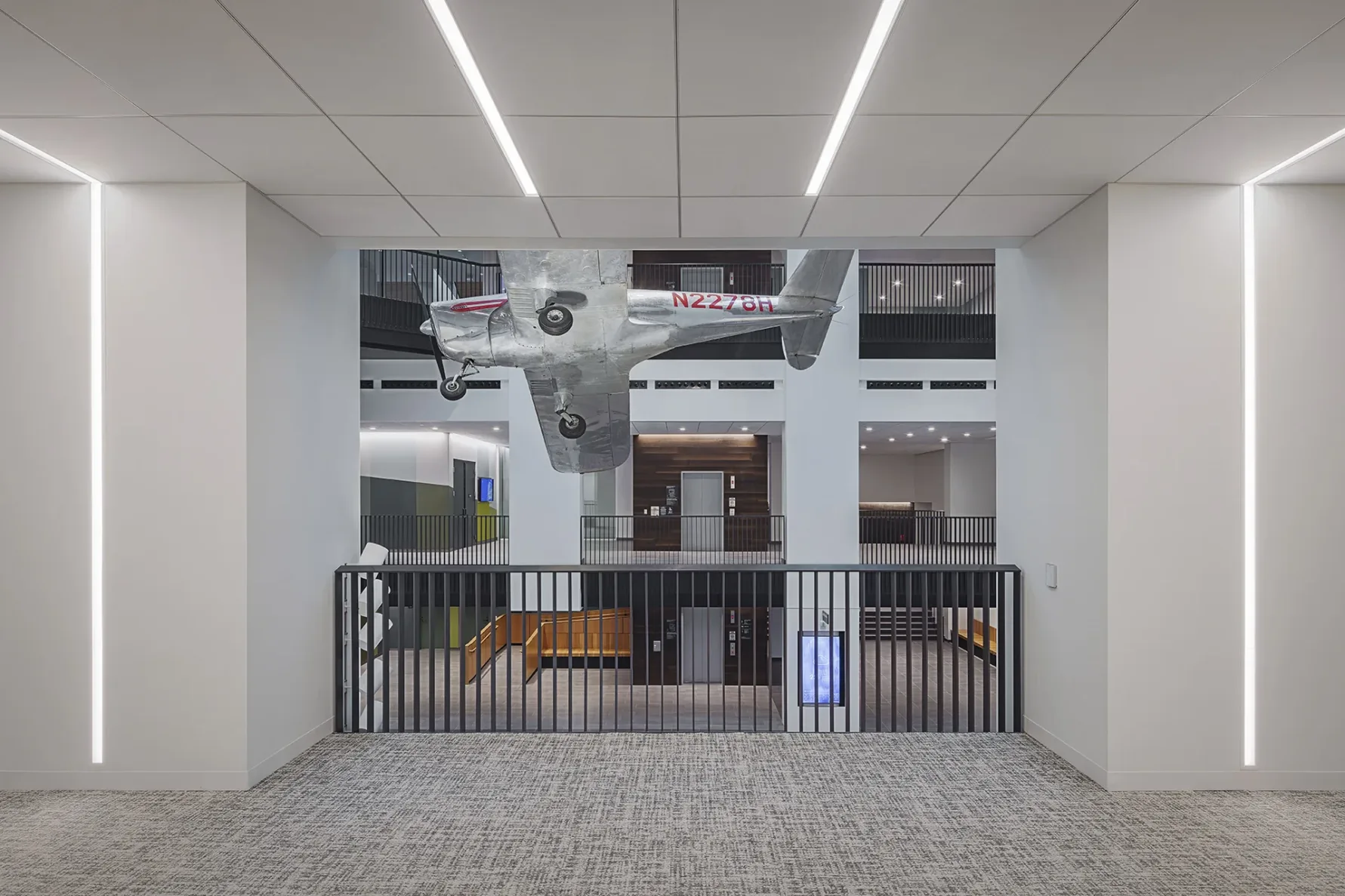 Sam Walton's original plane hanging in Walmart's Same Walton Hall