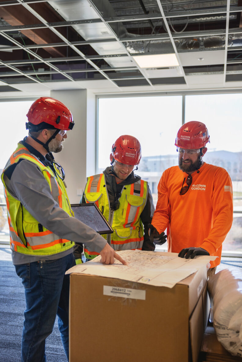 McCownGordon associates collaborating on jobsite.