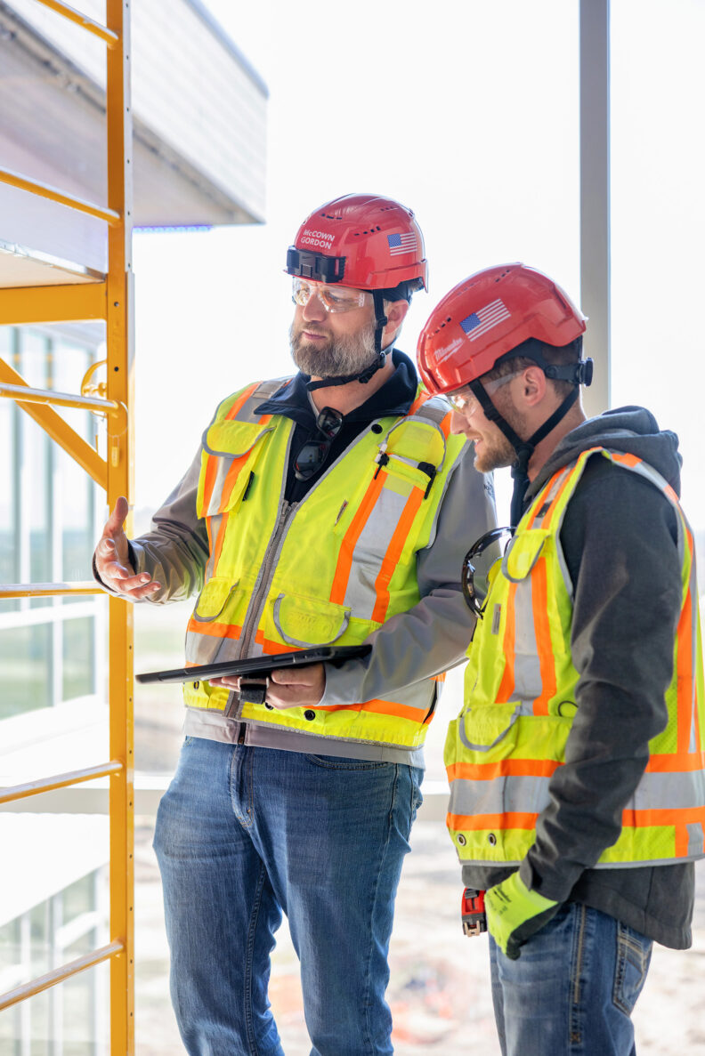 McCownGordon associates collaborating on jobsite.
