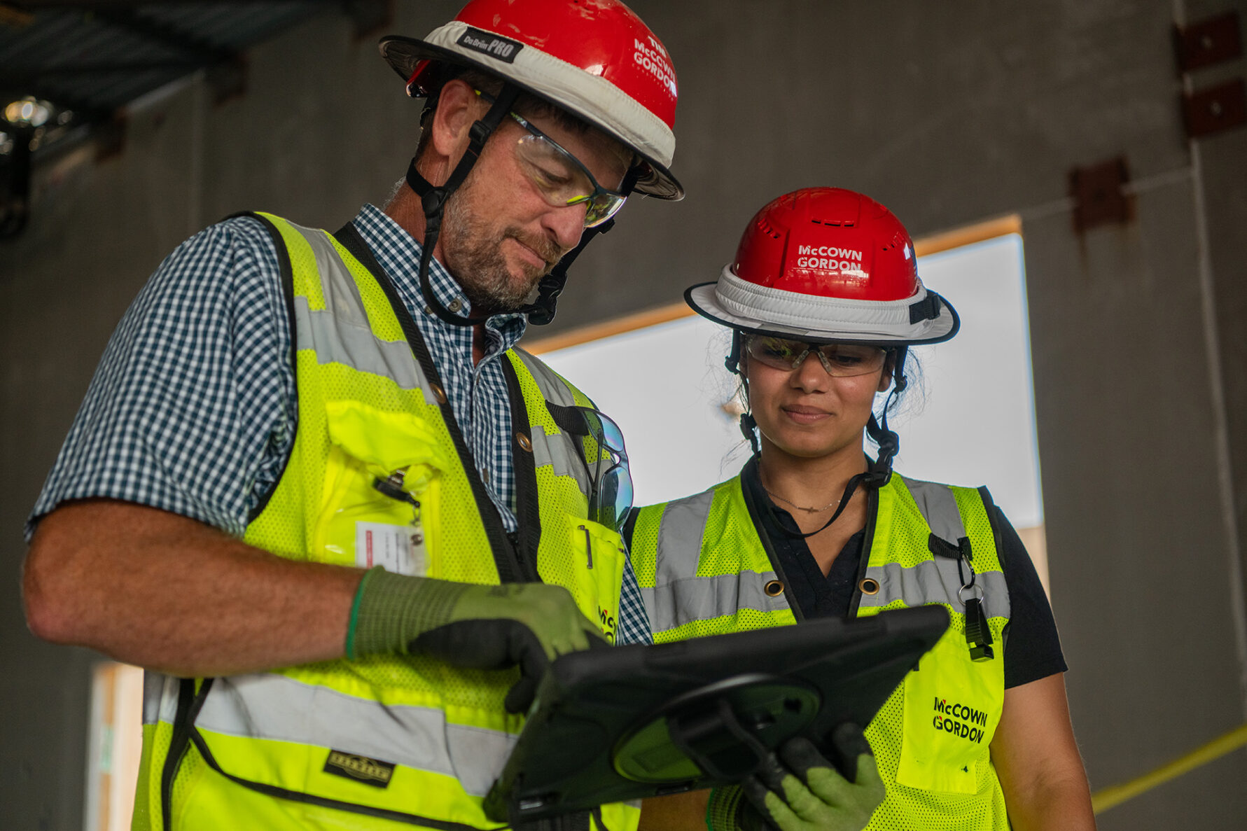 McCownGordon associates looking at ipad on jobsite