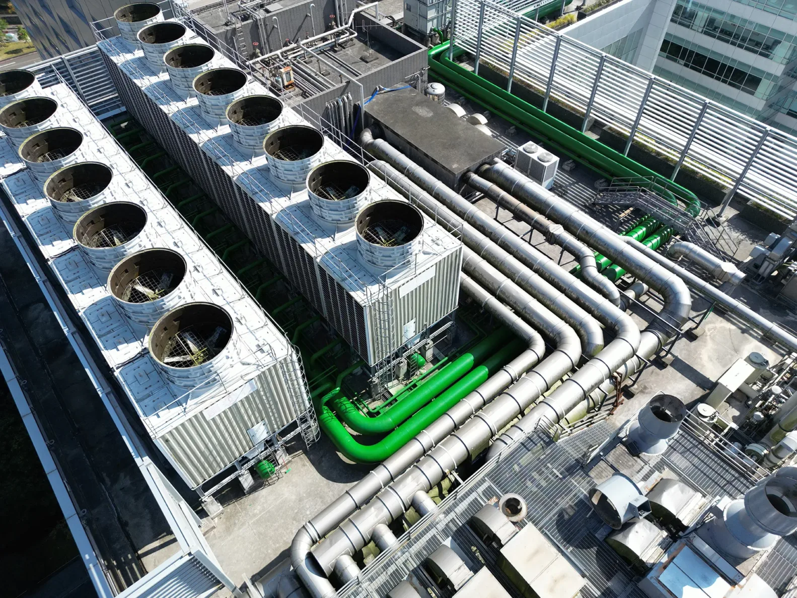 Aerial view of complex industrial piping and cooling towers